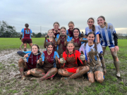 Muddy Showdown: Girls Football game in challenging conditions