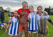 Muddy Showdown: Girls Football game in challenging conditions